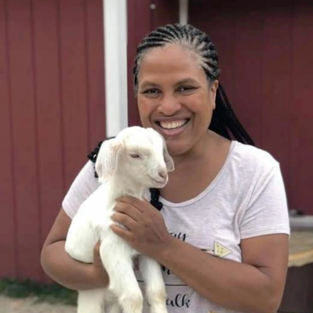 Rebecca J with a lamb
